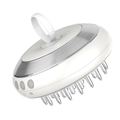 White scalp massager with comb-like design on a white background